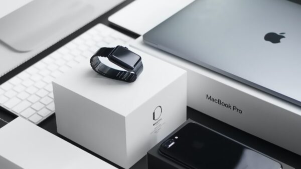 space black case Apple Watch, silver MacBook Pro, jet black iPhone 7 Plus, and silver iMac with corresponding boxes