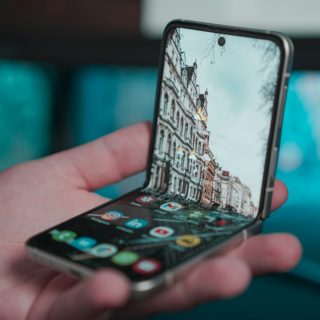 a person holding a cell phone in their hand