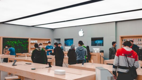 people standing and sitting inside room