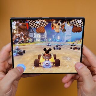 A person holding a video game in their hands