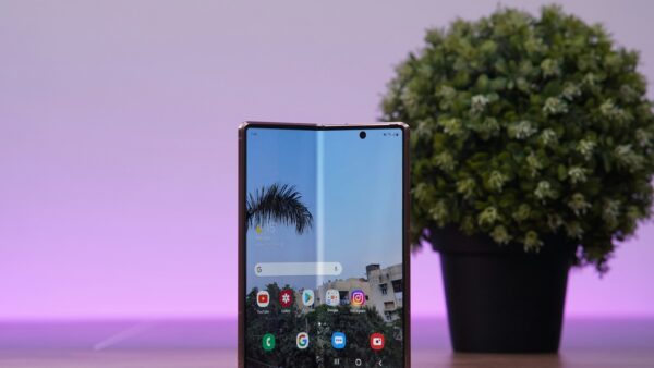 a cell phone with a tree in the background