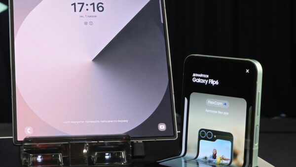 A cell phone and a laptop on a table