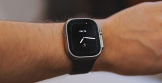 a close up of a person wearing a smart watch